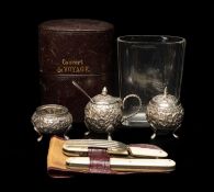 INDIAN WHITE METAL THREE PIECE CRUET & TRAVELLING EATING SET, the cruets of spherical form and