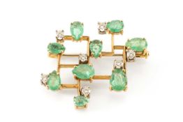 18CT GOLD MODERNIST EMERALD & DIAMOND BROOCH, set with nine pear-cut emeralds and seven round-cut