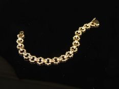 9CT GOLD FANCY BEADED RING-LINK BRACELET, 17cms (l), 17.4g Provenance: private collection