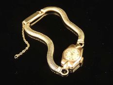TREBEX 9CT GOLD LADIES' BRACELET WRISTWATCH, 12mms dial, manual-wind movement, on a snake-link