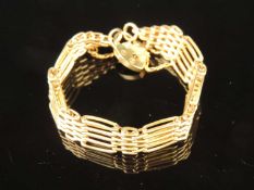 9CT GOLD GATE-LINK BRACELET with padlock clasp and safety chain, approx. 25g Provenance: private