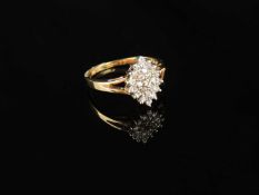 DIAMOND CLUSTER RING set with 23 tiny brilliants, on a 9ct split-shank yellow gold ring, size M, 2.