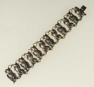 MEXICAN STERLING SILVER RUNNING HARE BRACELET, 19cms (l), 32mms (w), 45g Provenance: private