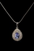 9K WHITE GOLD TANZANITE & DIAMOND PENDANT, the pear-cut tanzanite measuring 1.0cts approx., on white