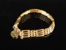9CT GOLD GATE-LINK BRACELET with padlock clasp and safety chain, 19cms (l), approx. 18g