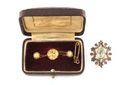 ANTIQUE YELLOW METAL BELIEVED CITRINE & DIAMOND BROOCH, the central round cut stone (10mms diameter)
