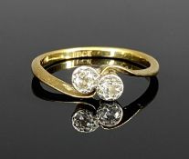 18CT GOLD CROSS OVER RING, illusion set with two small diamonds, size N, 2.3g Provenance: private