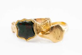 TWO YELLOW METAL RINGS comprising 18ct gold signet ring engraved with initials together with