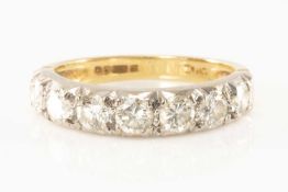 18CT GOLD SEVEN STONE DIAMOND RING, the round cut stones measuring 1.0cts overall approx., ring size