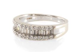 18CT GOLD DIAMOND HALF-HOOP RING, central band of baguette cut diamonds between brilliant cut