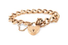 9CT GOLD CURB LINK BRACELET, heart shape padlock, safety chain, 17.9g Provenance: private collection