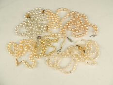 TWO CULTURED PEARL CHOKER NECKLACES, each with 9ct gold clasp, longest 46cms (l); also simulated