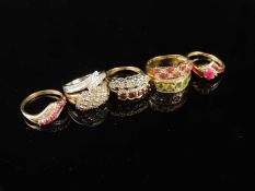 EIGHT VARIOUS GEM-SET DRESS RINGS in 9ct gold, including a diamond cross-over ring in white gold,