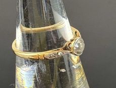 DIAMOND SOLITAIRE RING, old round-cut stone of approx. 0.25ct, set in platinum, shoulders set with