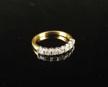 18CT WHITE & YELLOW GOLD DIAMOND HALF-ETERNITY RING, set with seven brilliants, totalling approx.
