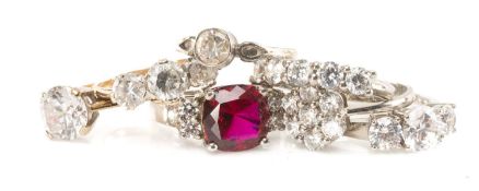 SEVEN ASSORTED SYNTHETIC GEM RINGS, including four 'Tru-Diamonds' synthetic white and red gem