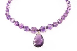 VINTAGE AMETHYST BEAD NECKLACE, pear shaped drop 30mm long, below string of faceted beads