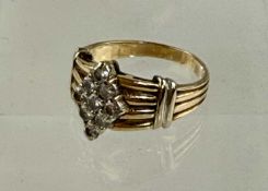 DIAMOND CLUSTER RING set with nine small brilliant-cut diamonds, in lozenge form on reeded band,