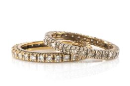TWO YELLOW METAL DIAMOND ETERNITY RINGS, one 9ct gold the other with foreign hallmarks, 4.9g