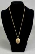 OVAL 9CT GOLD LOCKET with scroll engraved decoration, on 9ct gold chain, 4.6g Provenance: deceased