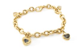 RARE VINTAGE CHOPARD 'HAPPY DIAMONDS' YELLOW METAL CHARM BRACELET, cable-link bracelet suspending