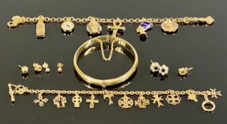 ASSORTED GOLD TONE JEWELLERY, including an Egyptian charm bracelet, another charm bracelet,