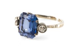 WHITE METAL SYNTHETIC SAPPHIRE & DIAMOND THREE STONE RING, the large central emerald cut synthetic