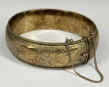 SILVER BANGLE with leaf engraved decoration, rope twist border, safety chain, 60 x 65mms, 39g