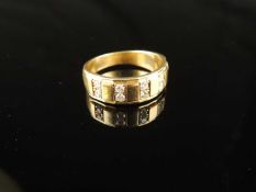 DIAMOND SET WEDDING RING in unmarked yellow gold, testing as 10ct, set with five pairs of