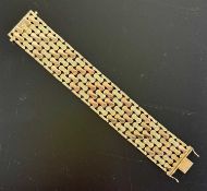 18CT GOLD WIDE TEXTURED LINK BRACELET, 19 (l) x 3cms (w), stamped '750', approx. 60g Provenance: