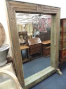 LARGE CARVED WOODEN FREE STANDING DOORWAY MIRROR, painted details, probably of Indian origin, 202