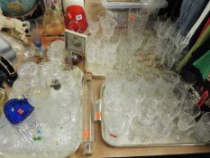 LARGE QUANTITY OF MIXED GLASS, mostly drinking glasses and ornamental pressed / cut glass