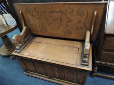 OAK LINEN FOLD CARVED MONK'S BENCH, 106cms (w), and an oak bureau (2) Provenance: private collection