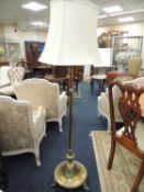 EDWARDIAN BRASS EXTENDABLE STANDARD LAMP, in the Adams style