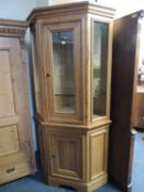 MODERN OAK ILLUMINATED CORNER DISPLAY CABINET, 196 (h) x 96cms (w) Provenance: private collection