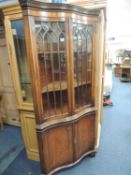 QUALITY MAHOGANY FREESTANDING CORNER DISPLAY CABINET with serpentine front, 189cms (h) Provenance: