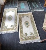THREE SMALL TURKISH GREEN GROUND WOOLLEN RUGS, and two Chinese style cream ground sculpted woollen