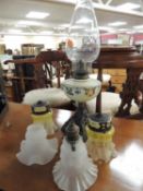 VICTORIAN PEDESTAL OIL LAMP, pair of late Victorian etched green-tinted glass shades, and two