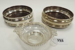 SILVER PIERCED BONBON DISH, Sheffield 1912, 50g, and pair of silver-plated bottle coasters (3)