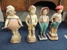 FOUR PAINTED PLASTER FIGURES, including whistling boy and shy girl, the tallest 61cms (h)