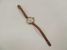 LADIES' 9CT GOLD CASED VINTAGE WRISTWATCH, on leather strap Provenance: private collection