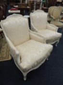 PAIR OF FRENCH STYLE ARMCHAIRS, having painted wooden frames and ivory silk upholstery, 79cm (w)