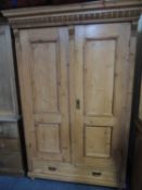 CONTINENTAL STYLE STRIPPED PINE TWO-DOOR WARDROBE, 190 (h) x 128 (w) x 59cms (d)
