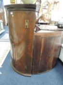 GEORGE III MAHOGANY BOW FRONT HANGING CORNER CUPBOARD, 110 (h) x 73cms (w), and further oak bow