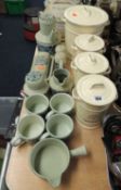 TWO SUITES OF KITCHEN POTTERY, comprising set of provision jars and a mid-winter breakfast set