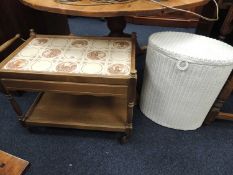 RETRO TILE TOPPED OAK TEA TROLLEY and a Lloyd Loom linen basket (2)