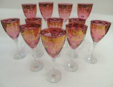 SUITE OF TWELVE BOHEMIAN CZECH ROSE-TINTED WINE GLASSES, with clear glass stems