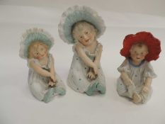 TWO ANTIQUE HEUBACH BISQUE BONNET GIRLS, and another similar (3) Provenance: private collection