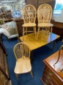 FOUR MODERN BEECH WHEEL BACK KITCHEN CHAIRS Provenance: private collection Cheshire