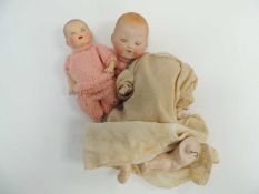 TWO ARMAND MARSEILLE BISQUE HEADED BABY DOLLS Provenance: private collection Flintshire
